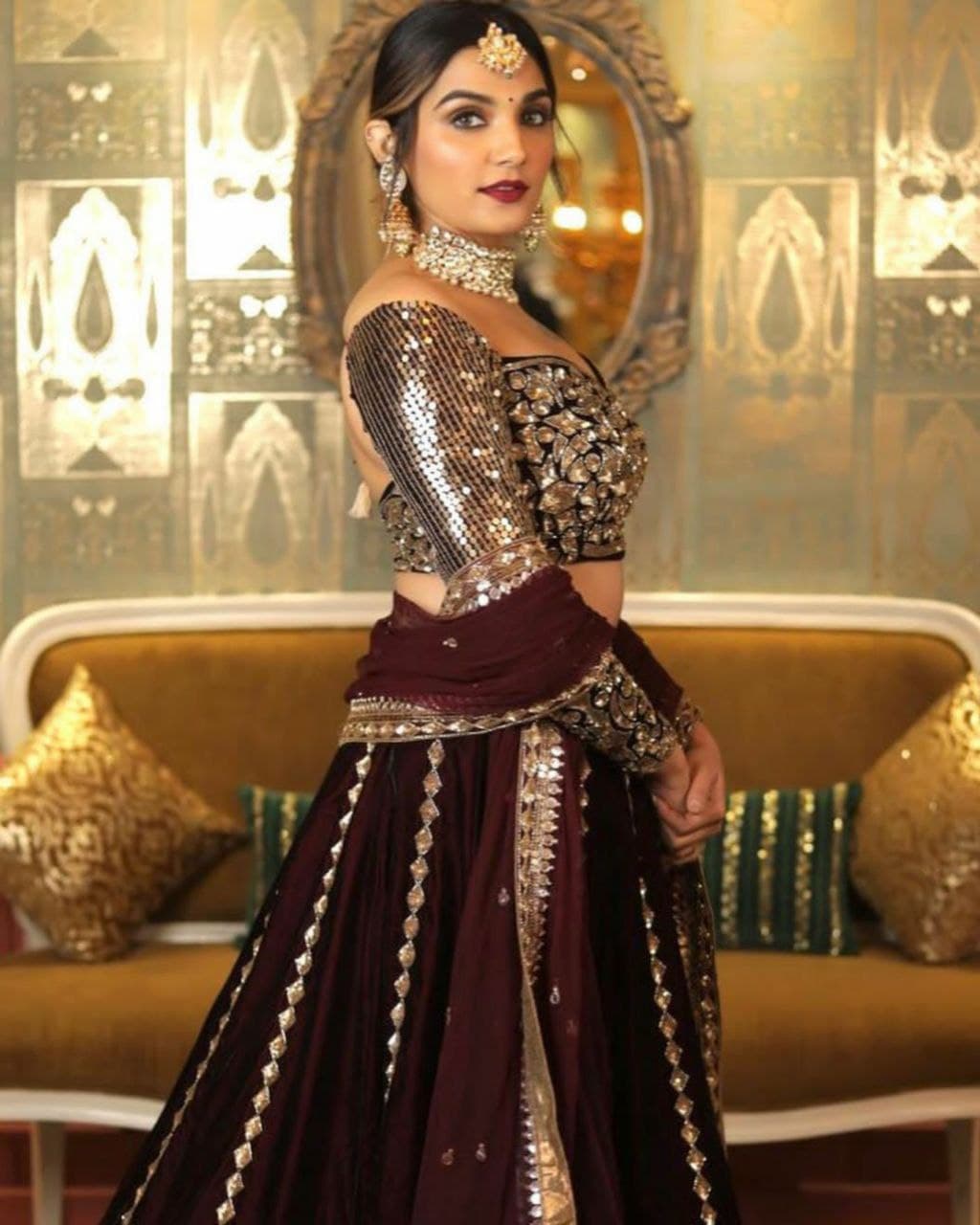 Demanding Wine Sequence Embroidered Velvet Lehenga Choli